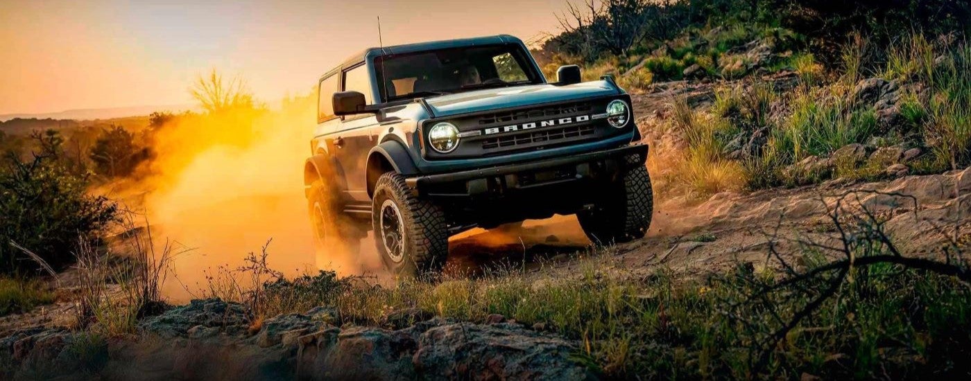 Blue 2022 Ford Bronco parked off-road.