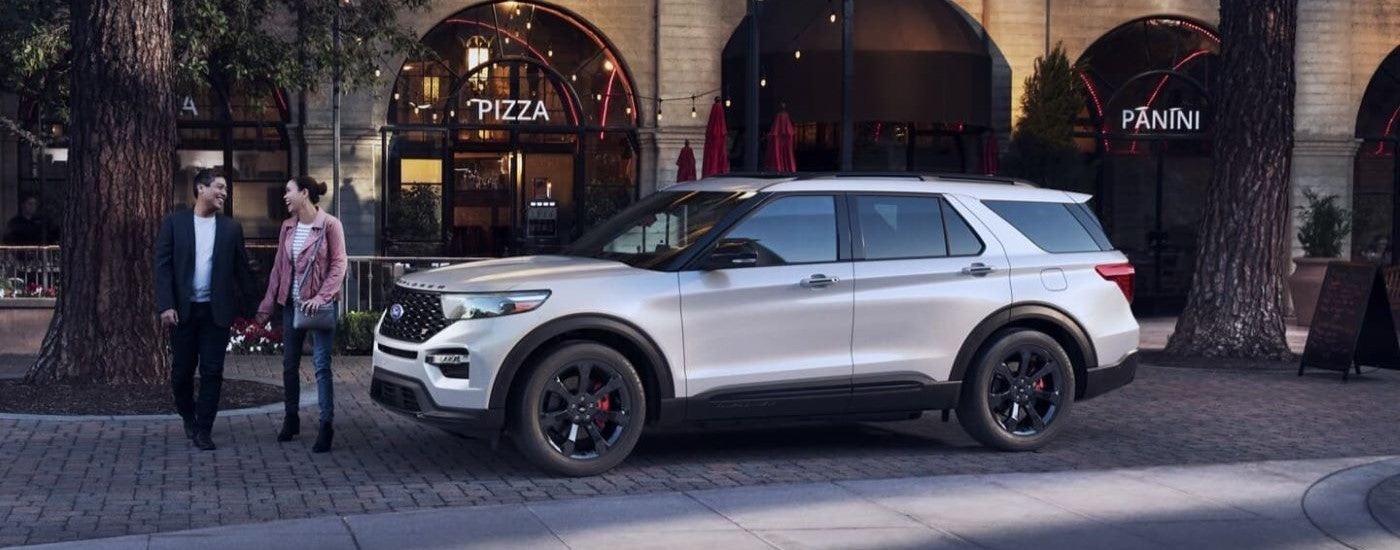 White 2022 Ford Explorer parked to see a used Ford for sale in Lansing
