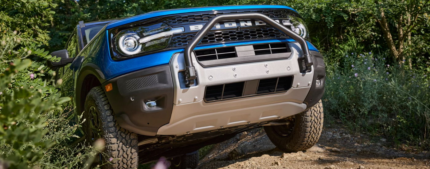 Blue 2025 Ford Bronco Sport emerging from a trail