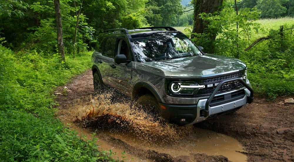 Silver 2026 Ford Bronco Sport driving off-road.