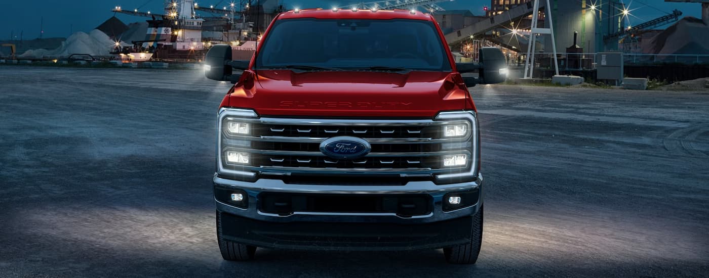 Front of a red 2026 Ford F-250 parked on pavement.