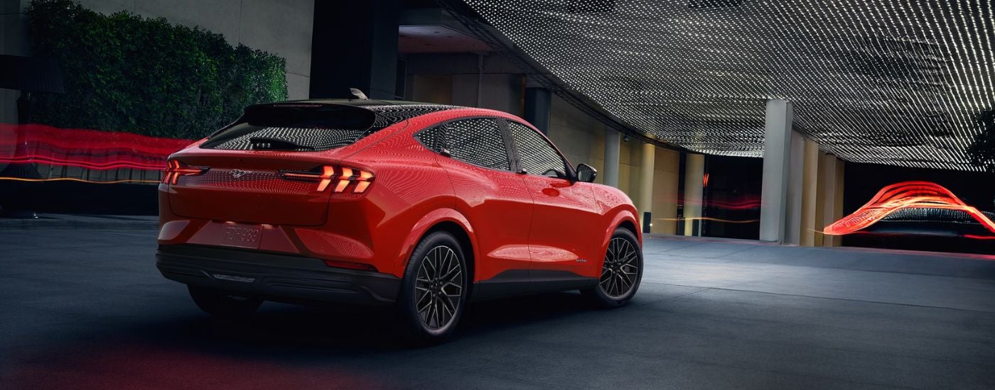 Rear view of a 2026 Ford Mustang Mach-E driving.